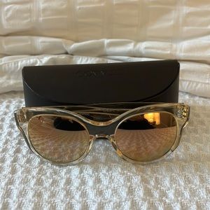 Oliver People’s sunglasses with mirror lenses